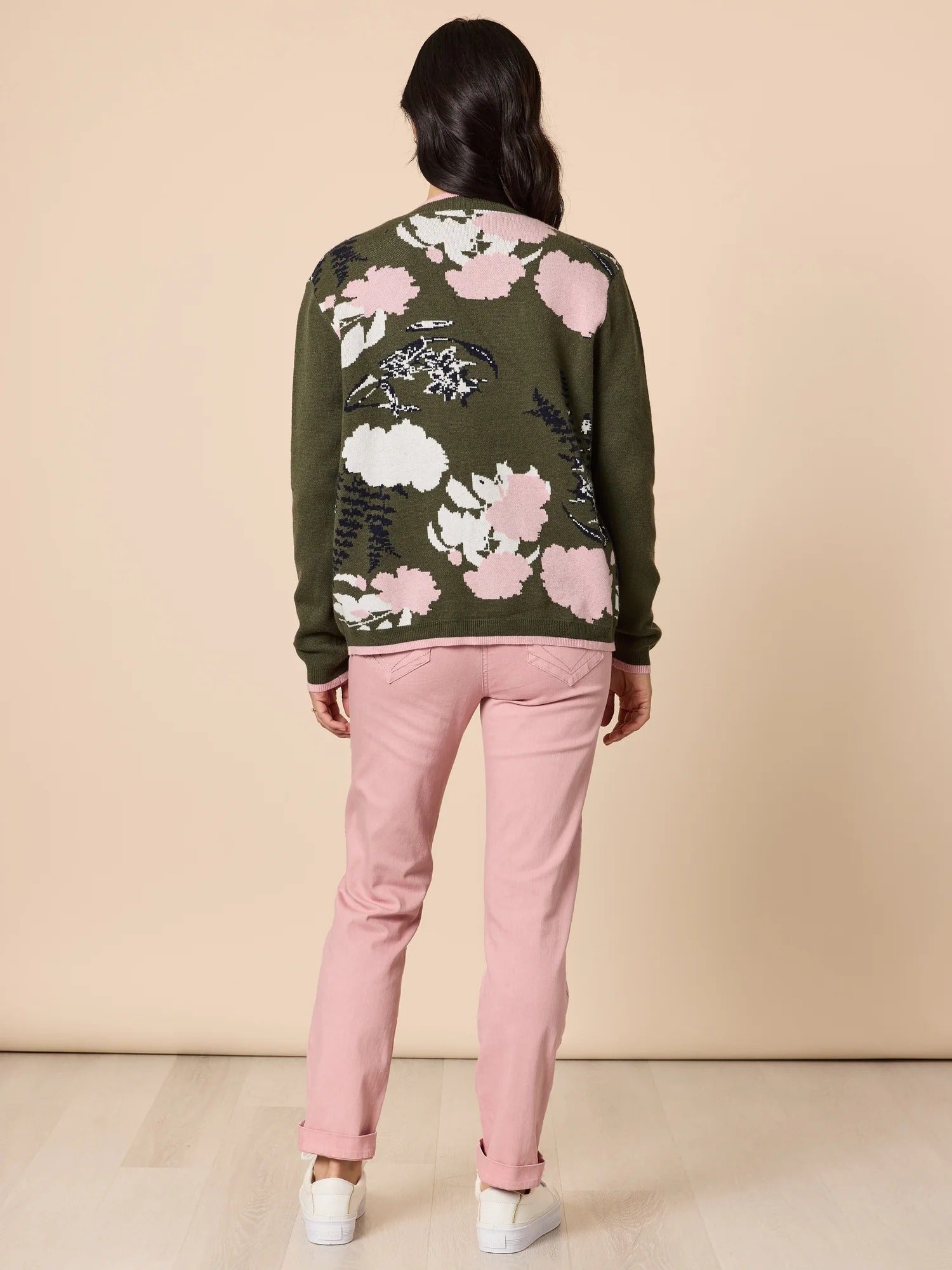 Back view of women’s khaki floral knit cardigan with pink and white pattern, styled with blush pants, showcasing rear design from Showies Boutique Adelaide