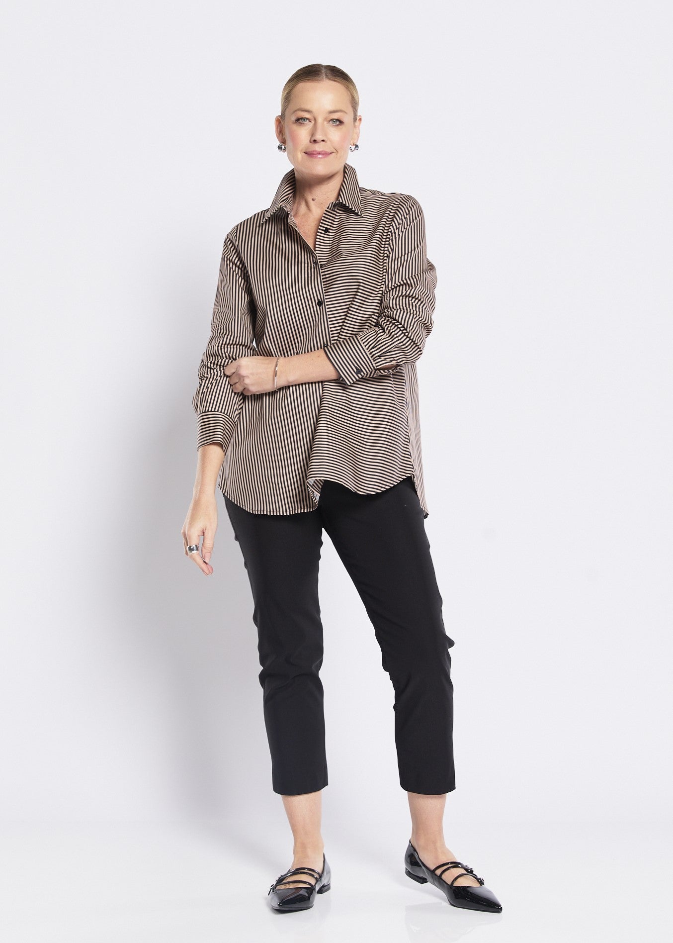 Women’s tailored striped blouse front view with slim black pants clean minimal look