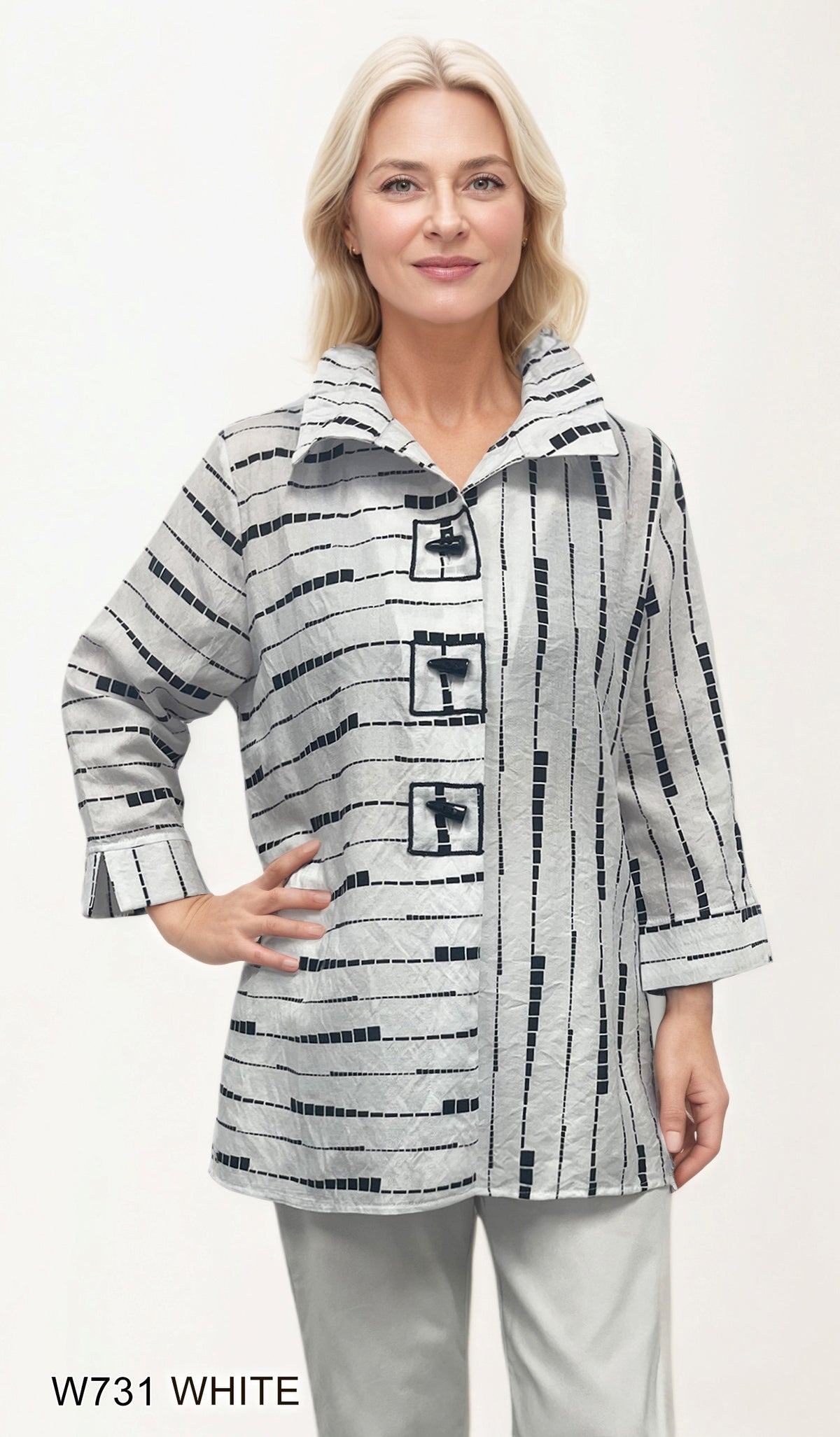 White and black geometric print jacket with three-quarter sleeves.